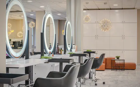 Inside the salon: ring-lit mirrors and styling chairs